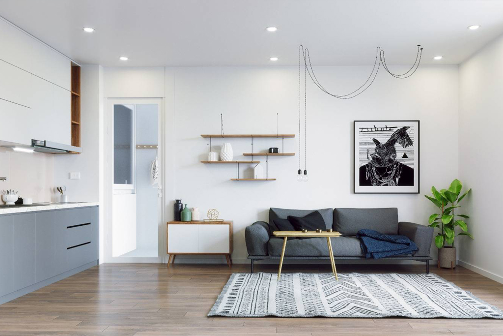 Open kitchen and living room in a Los Angeles ADU with flat-panel cabinets, floating shelves, and wood-look floors