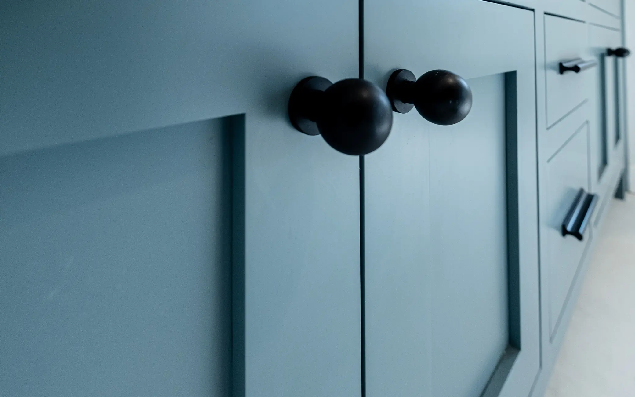 Detail of matte black cabinet hardware in a Los Angeles bathroom remodel