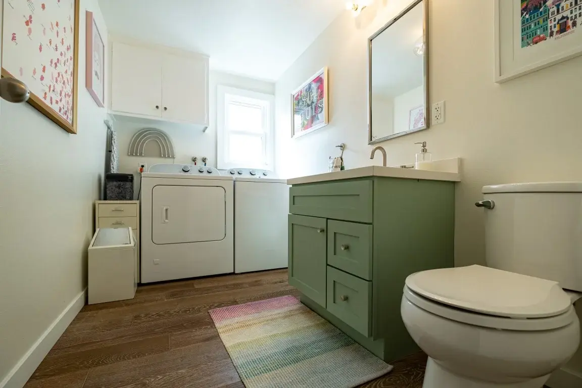 Combined laundry and bathroom space in a Los Angeles full home renovation
