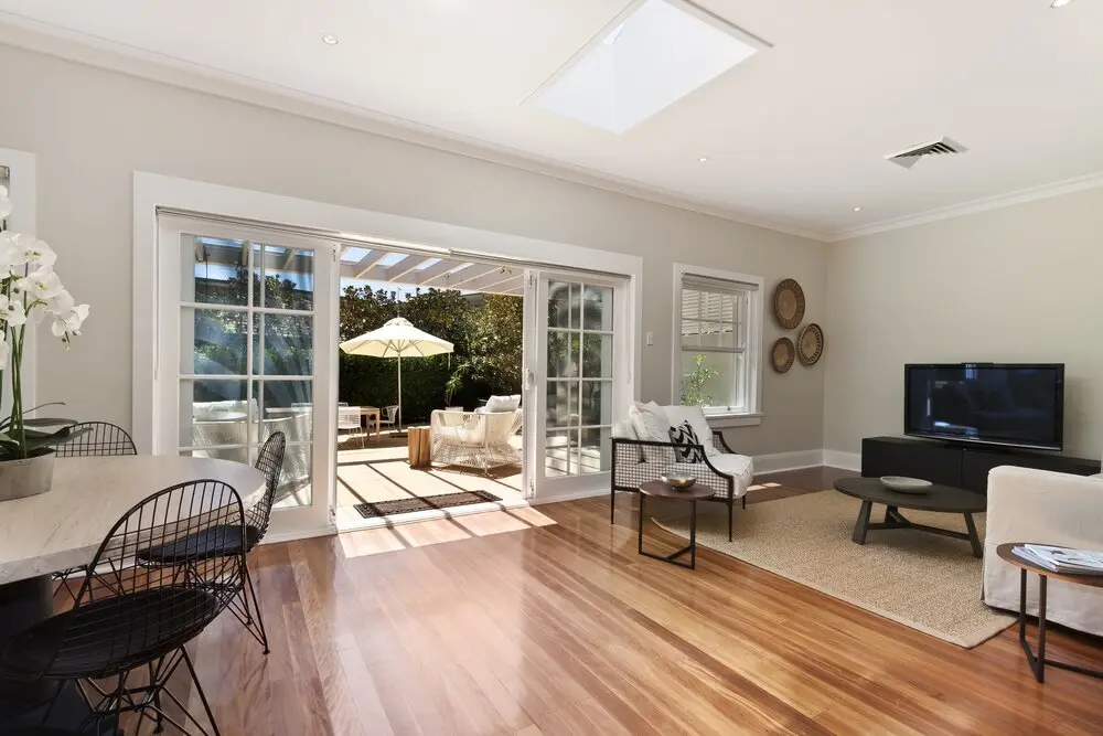 Living room with French doors and a skylight in a Los Angeles full home renovation
