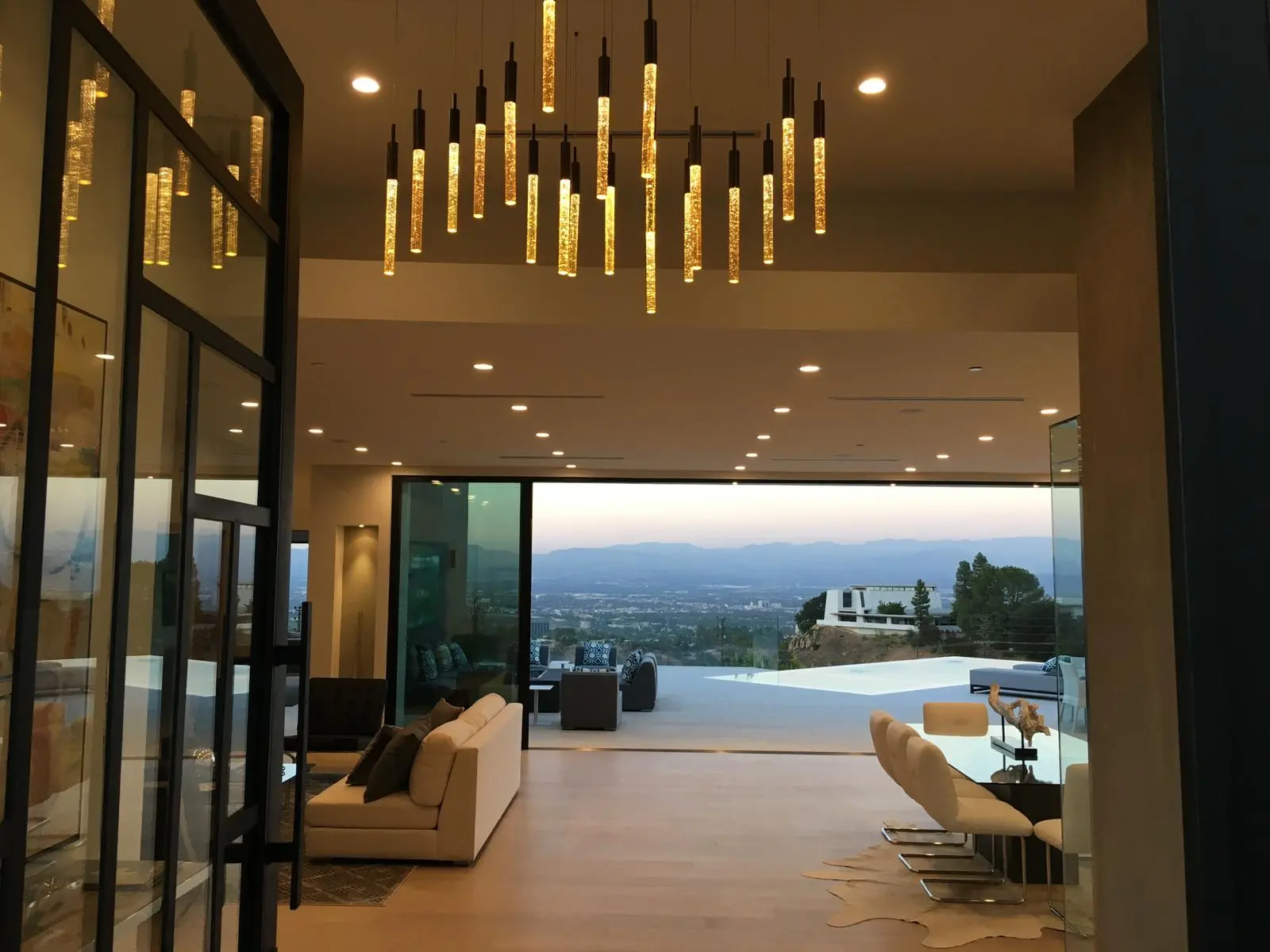 Living room overlooking an infinity pool and hillside view in a Los Angeles full home renovation