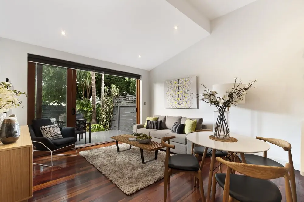 Living room opening to a patio in a Los Angeles full home renovation