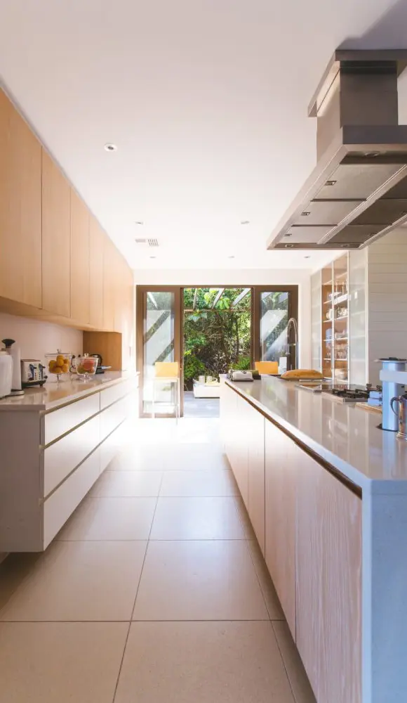 Galley-style kitchen remodel in Los Angeles opening onto a courtyard