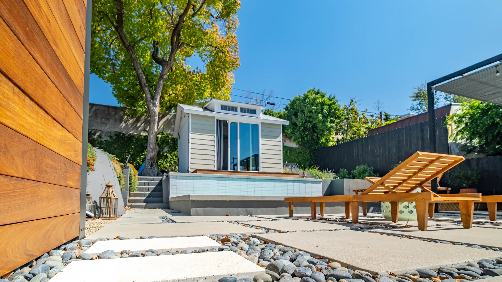 Modern Los Angeles backyard guest suite / ADU with plunge pool and paver hardscape