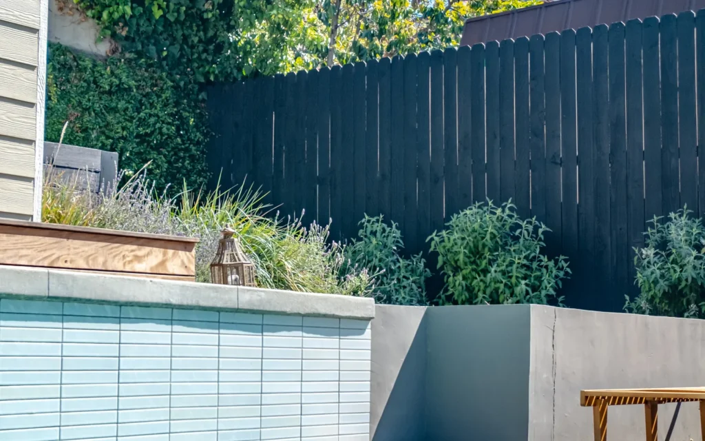 Custom pool with glass tile spa edge in Los Feliz