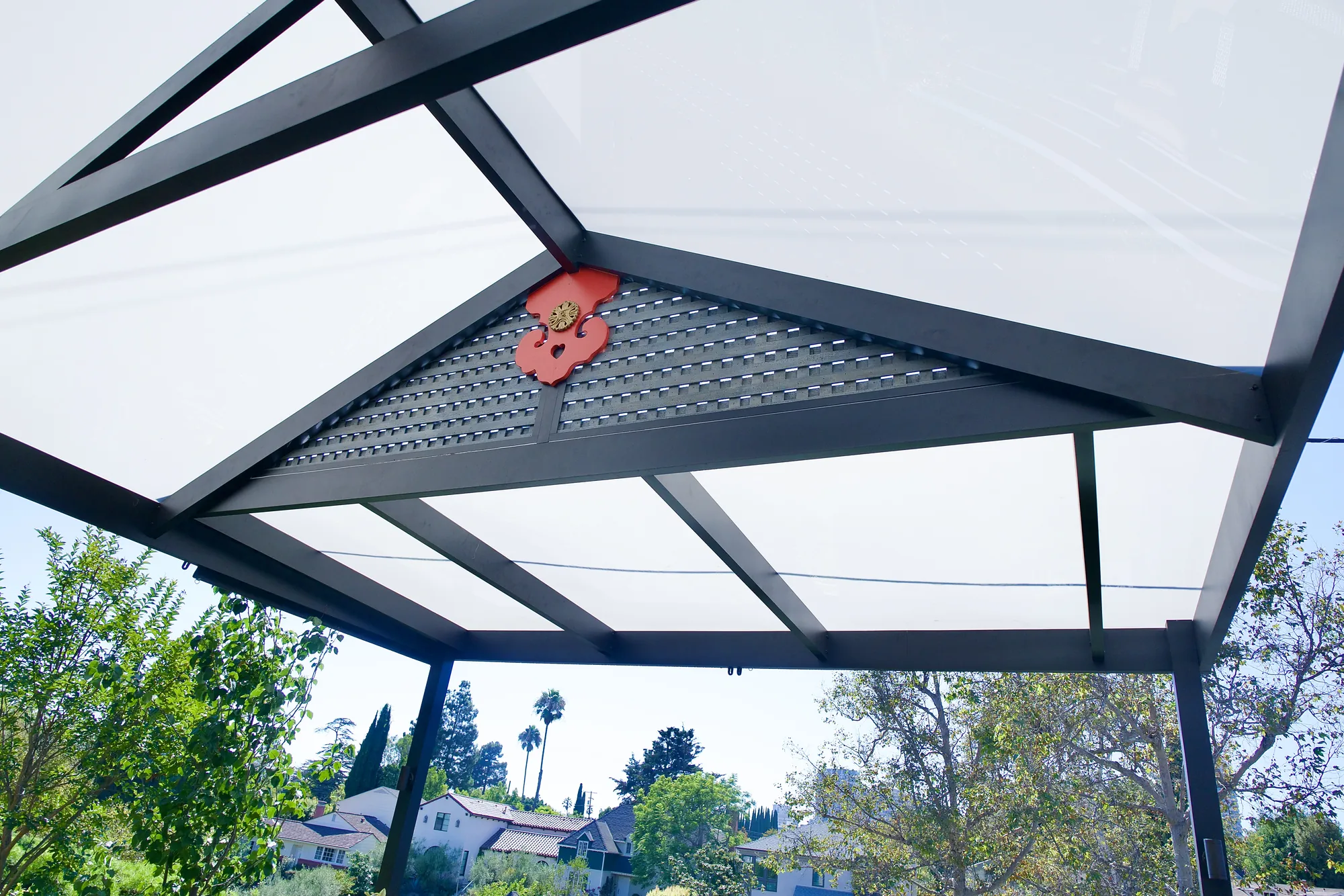 Translucent pergola panels and a lattice gable with a Japanese ornament on a deck in Los Angeles