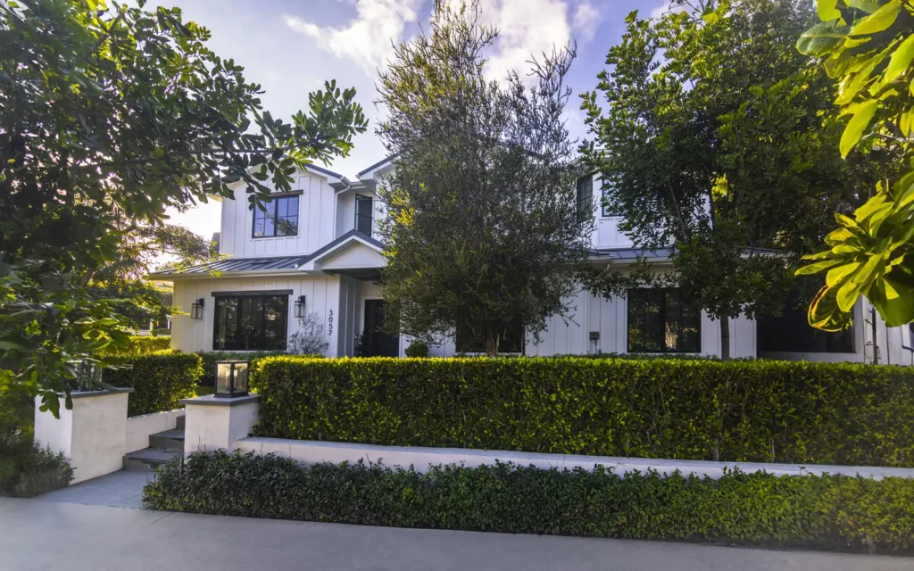 Manicured front lawn and hedges at a renovated Cheviot Hills home