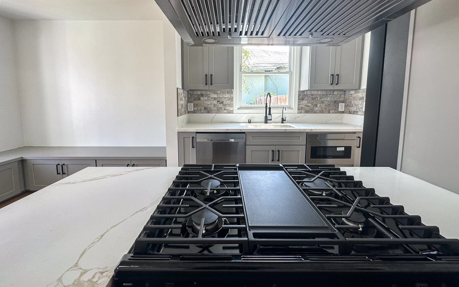 Remodeled Santa Monica kitchen with professional range and white quartz counters