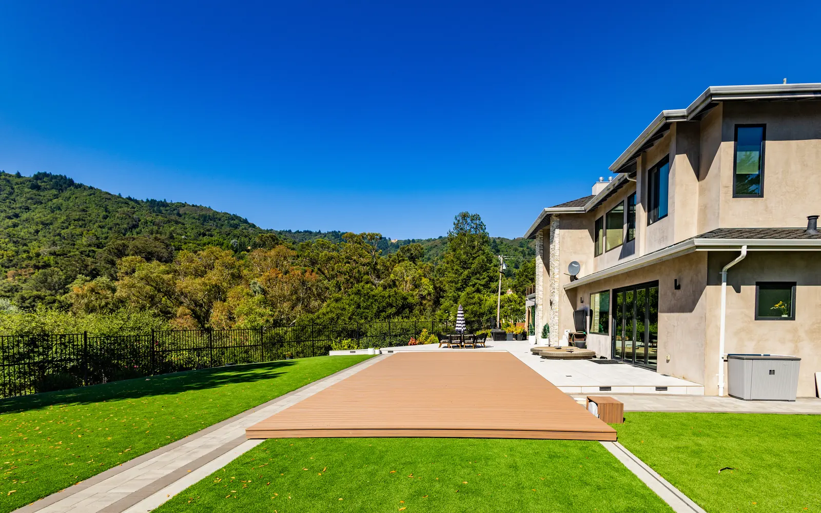 Movable pool floor closed flush with the lawn at a San Jose estate